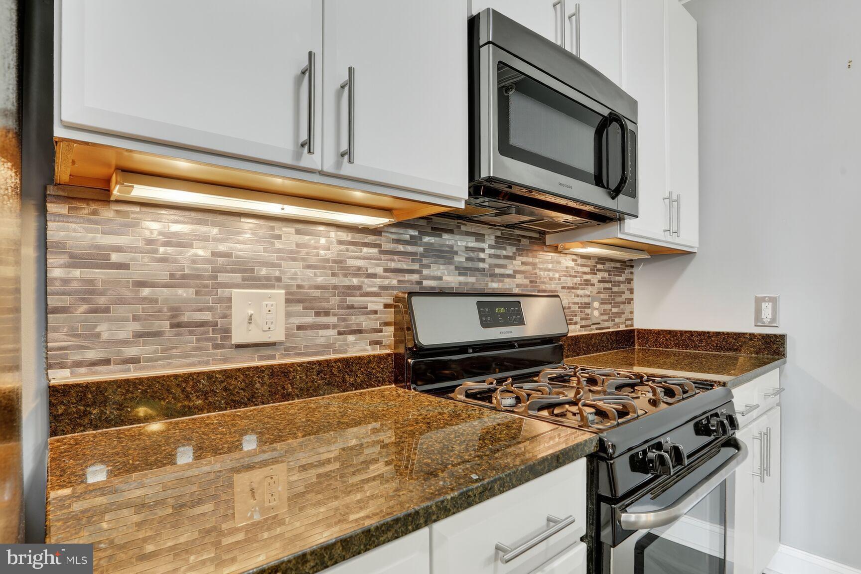 6301 Edsall Road, Unit 123 Alexandria, VA 22312 - Photo 7 of 36 Sleek kitchen with modern finishes.