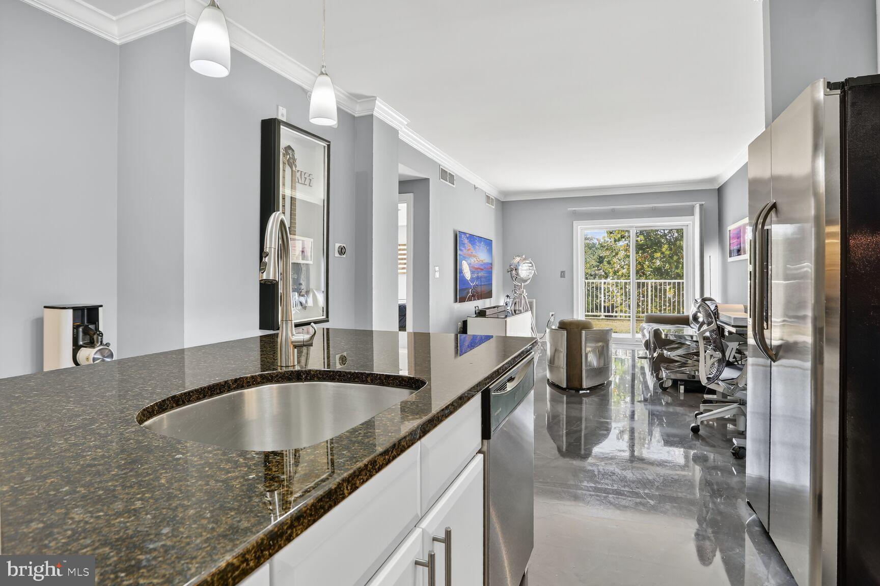6301 Edsall Road, Unit 123 Alexandria, VA 22312 - Photo 8 of 36 Modern kitchen with sleek finishes and light.