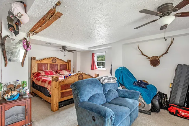 a bathroom with a sink vanity mirror and toilet