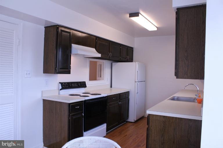 2 Tynewick Court Silver Spring, MD 20906 - Photo 9 of 30 Kitchen with pass thru to dining room