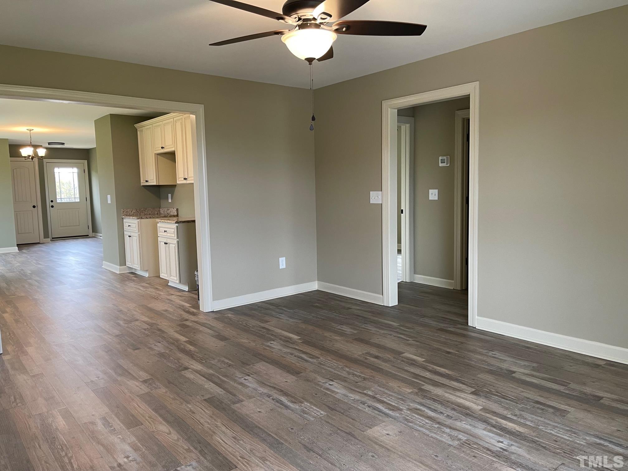 675 Bethel Church Road Angier, NC 27501 - Photo 4 of 23 wooden floor in an empty room with a window