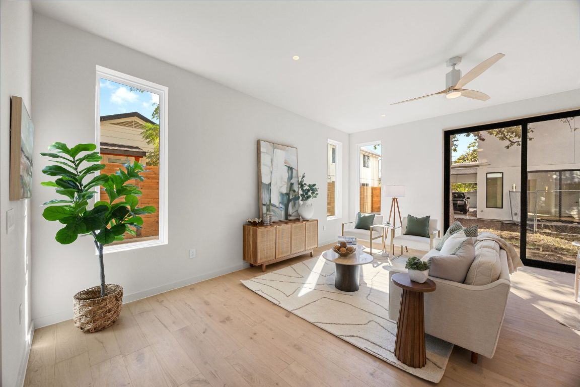 1175 Navasota Street, Unit 2 Austin, TX 78702 - Photo 11 of 40 a living room with furniture and a potted plant