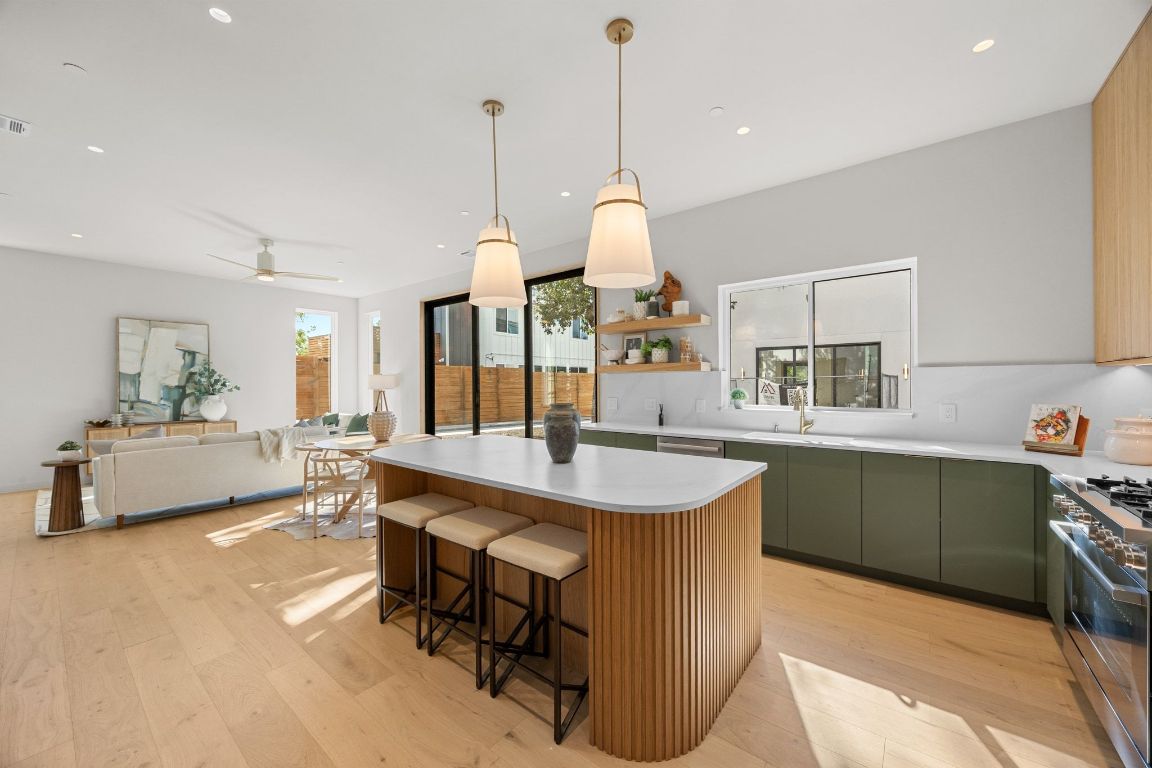1175 Navasota Street, Unit 2 Austin, TX 78702 - Photo 15 of 40 a large kitchen with a table and chairs
