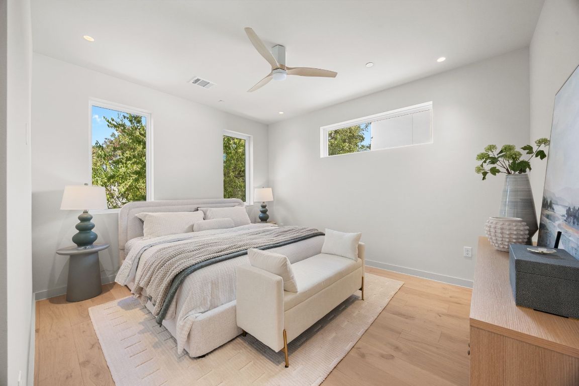 1175 Navasota Street, Unit 2 Austin, TX 78702 - Photo 21 of 40 a bedroom with a bed and a couch