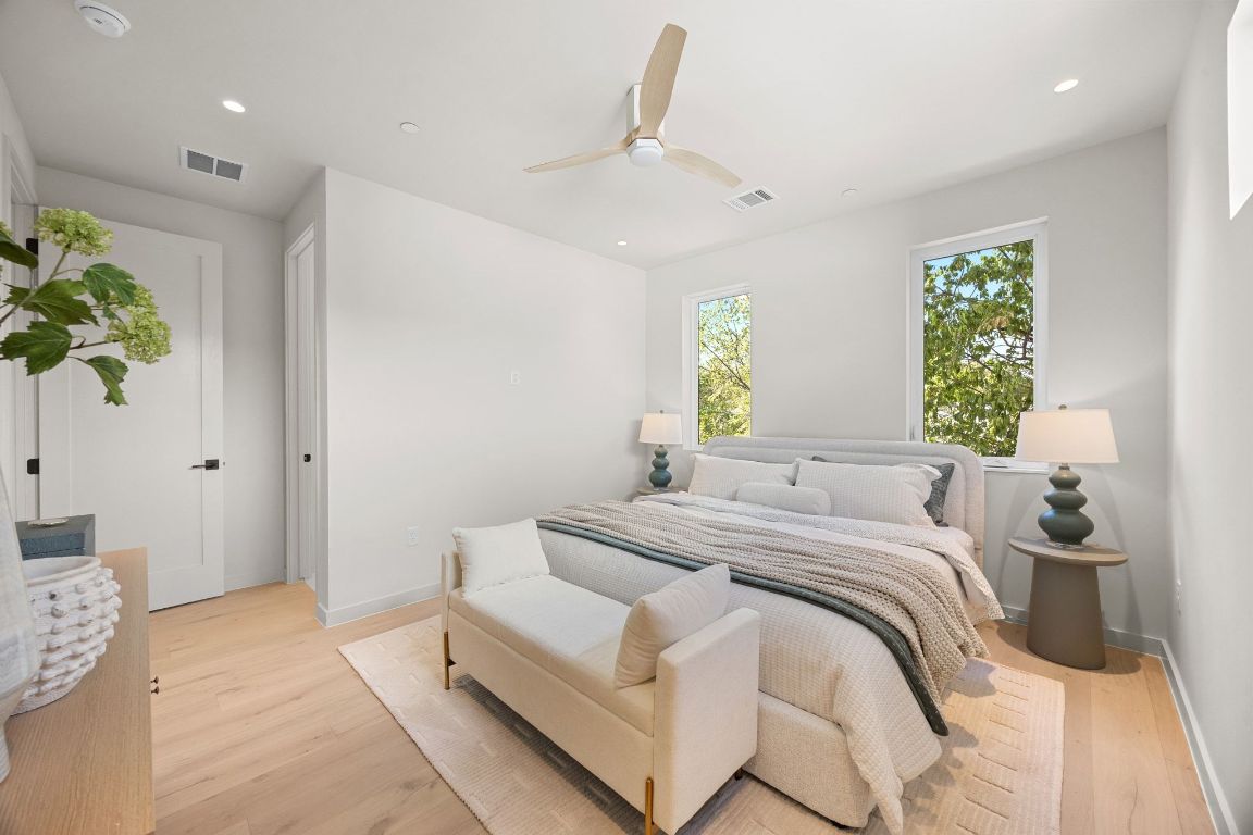 1175 Navasota Street, Unit 2 Austin, TX 78702 - Photo 22 of 40 a bedroom with a bed and a window
