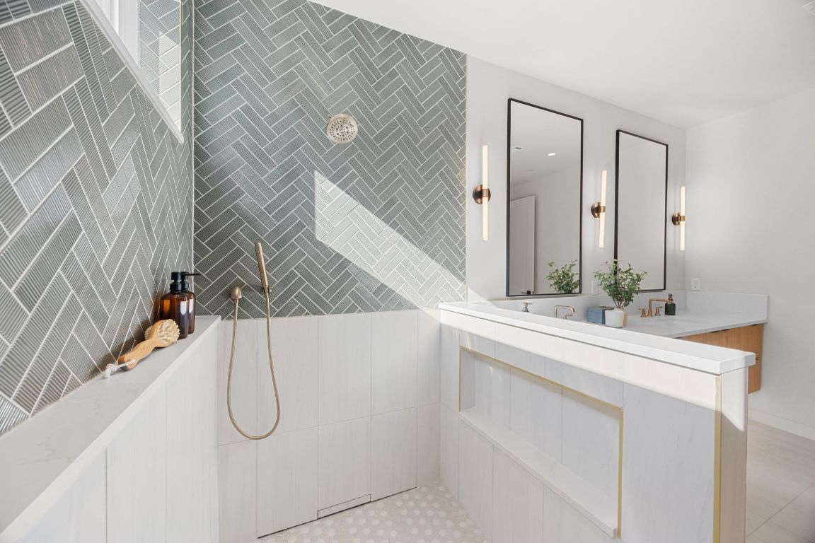 1175 Navasota Street, Unit 2 Austin, TX 78702 - Photo 24 of 40 a bathroom with a double vanity sink and mirror