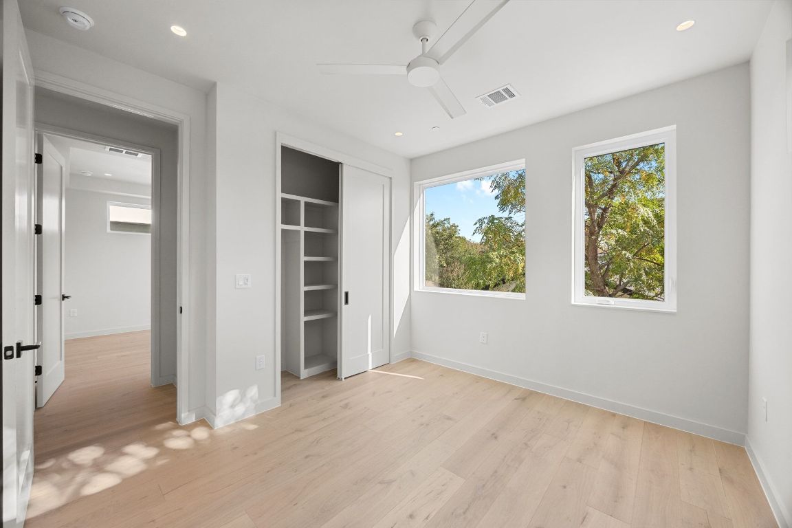 1175 Navasota Street, Unit 2 Austin, TX 78702 - Photo 26 of 40 an empty room with windows and closet