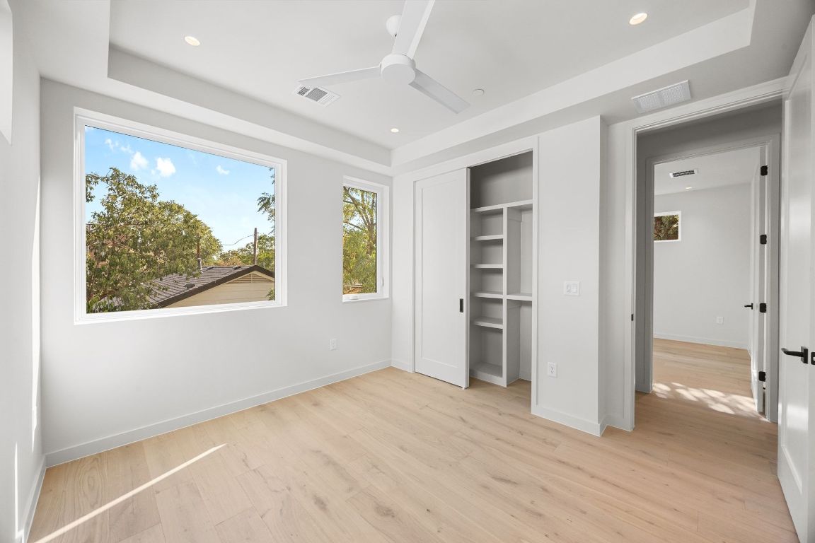 1175 Navasota Street, Unit 2 Austin, TX 78702 - Photo 28 of 40 an empty room with windows and closet