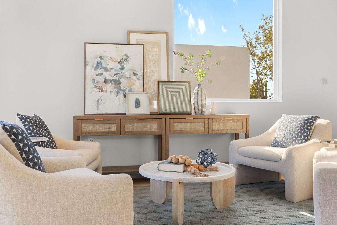 1175 Navasota Street, Unit 2 Austin, TX 78702 - Photo 32 of 40 a living room with furniture and wall paintings