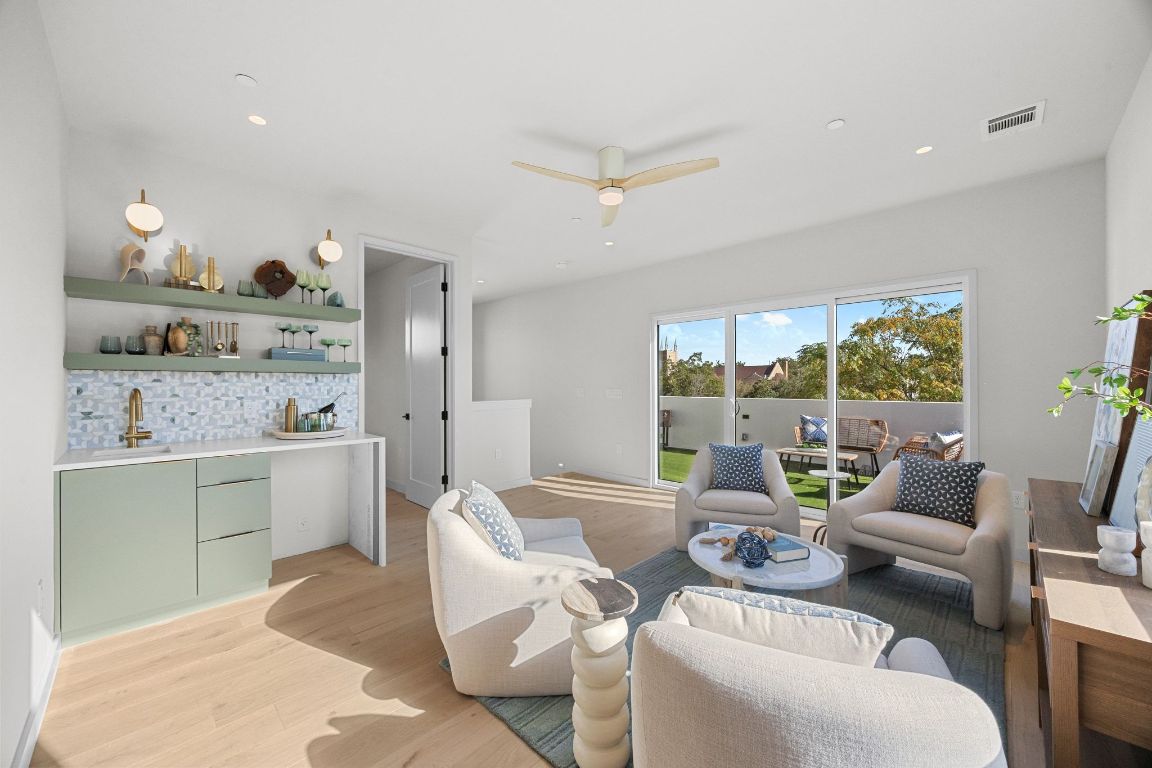 1175 Navasota Street, Unit 2 Austin, TX 78702 - Photo 33 of 40 a living room with furniture and a kitchen view