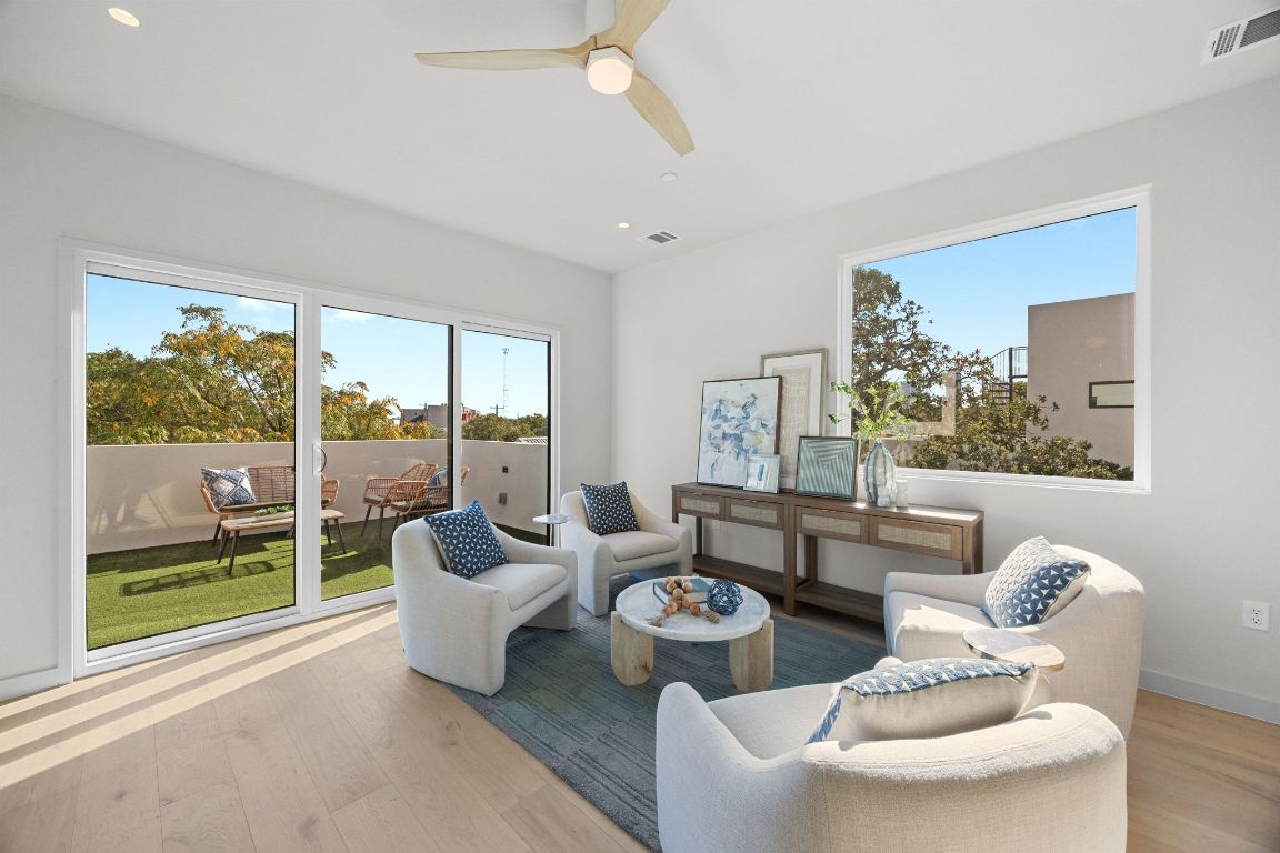 1175 Navasota Street, Unit 2 Austin, TX 78702 - Photo 35 of 40 a living room with furniture and a large window