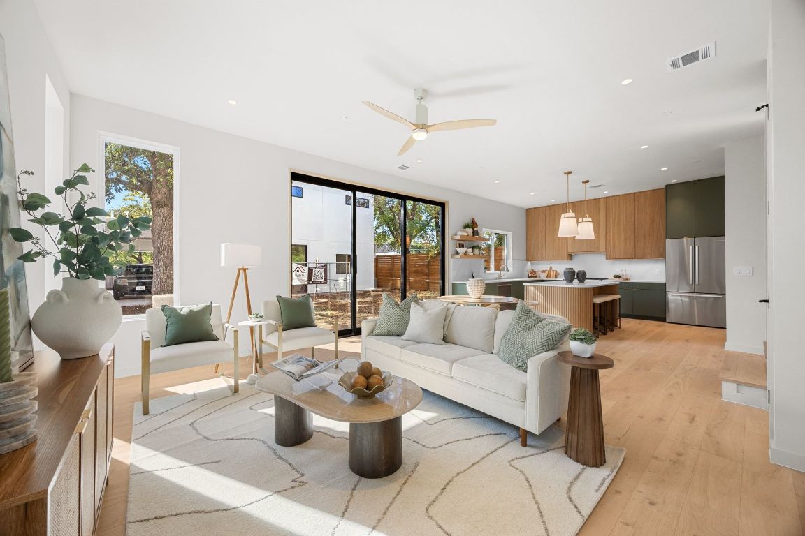 1175 Navasota Street, Unit 2 Austin, TX 78702 - Photo 5 of 40 a living room with furniture and a large window