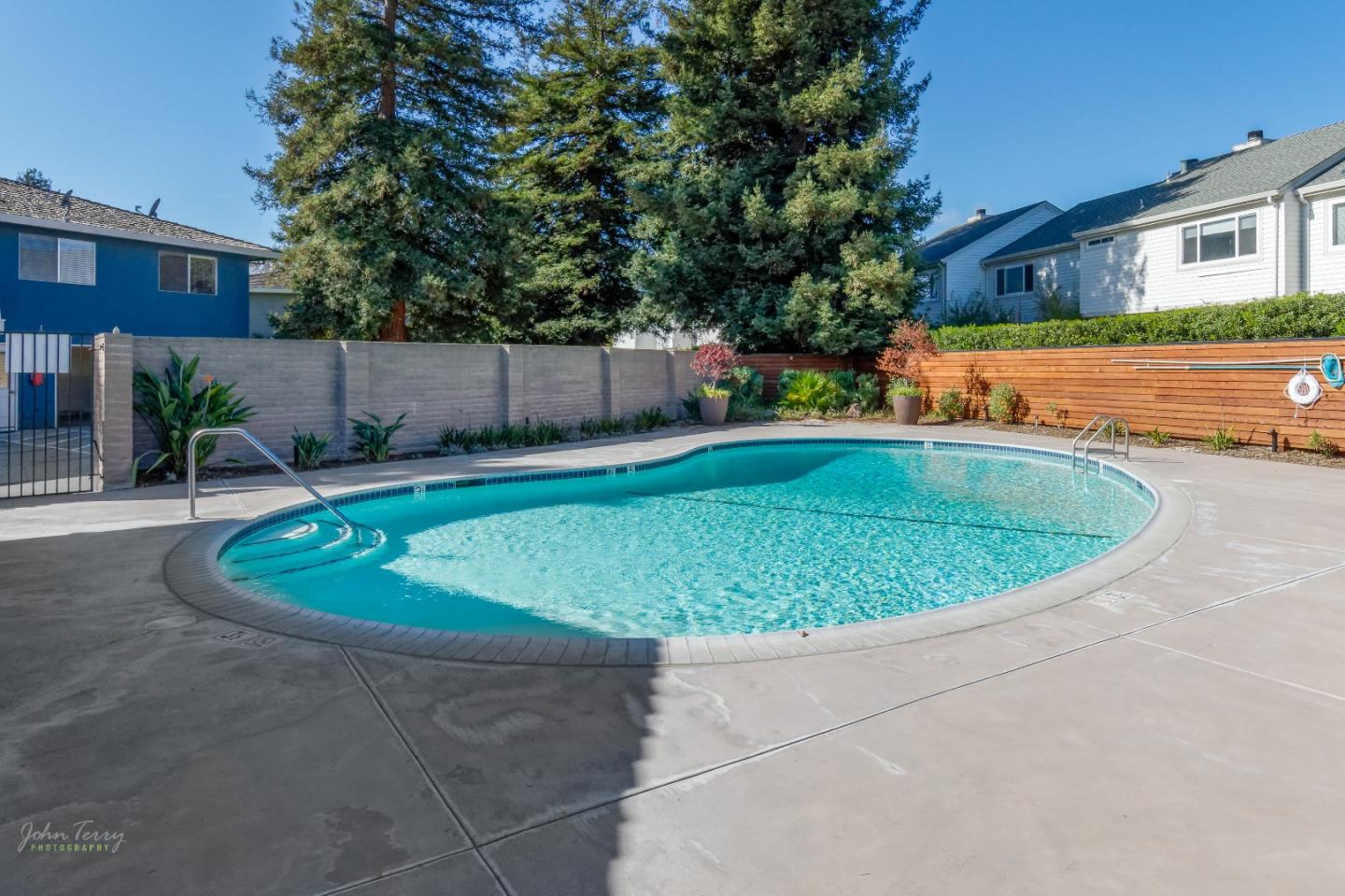 4435 Diamond Street, Unit 1 Capitola, CA 95010 - Photo 11 of 18 a view of a swimming pool with a patio
