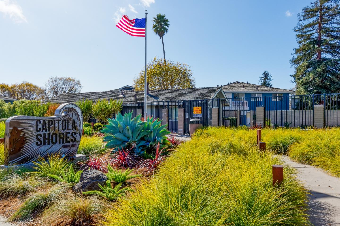 4435 Diamond Street, Unit 1 Capitola, CA 95010 - Photo 13 of 18 a front view of a house with swimming pool and porch