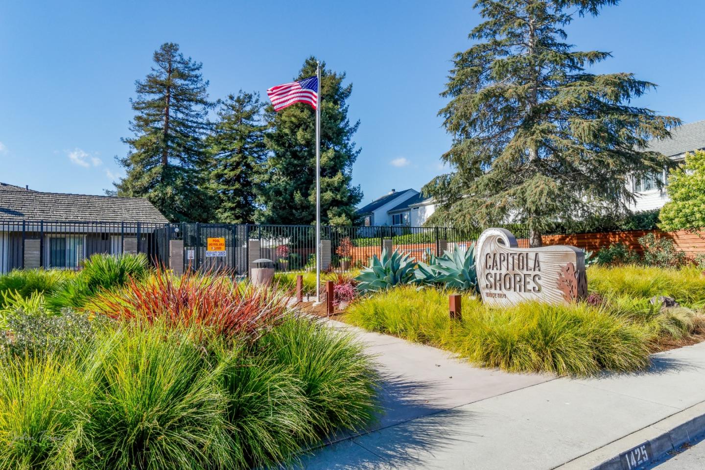 4435 Diamond Street, Unit 1 Capitola, CA 95010 - Photo 15 of 18 a view of a house with a yard and sitting area