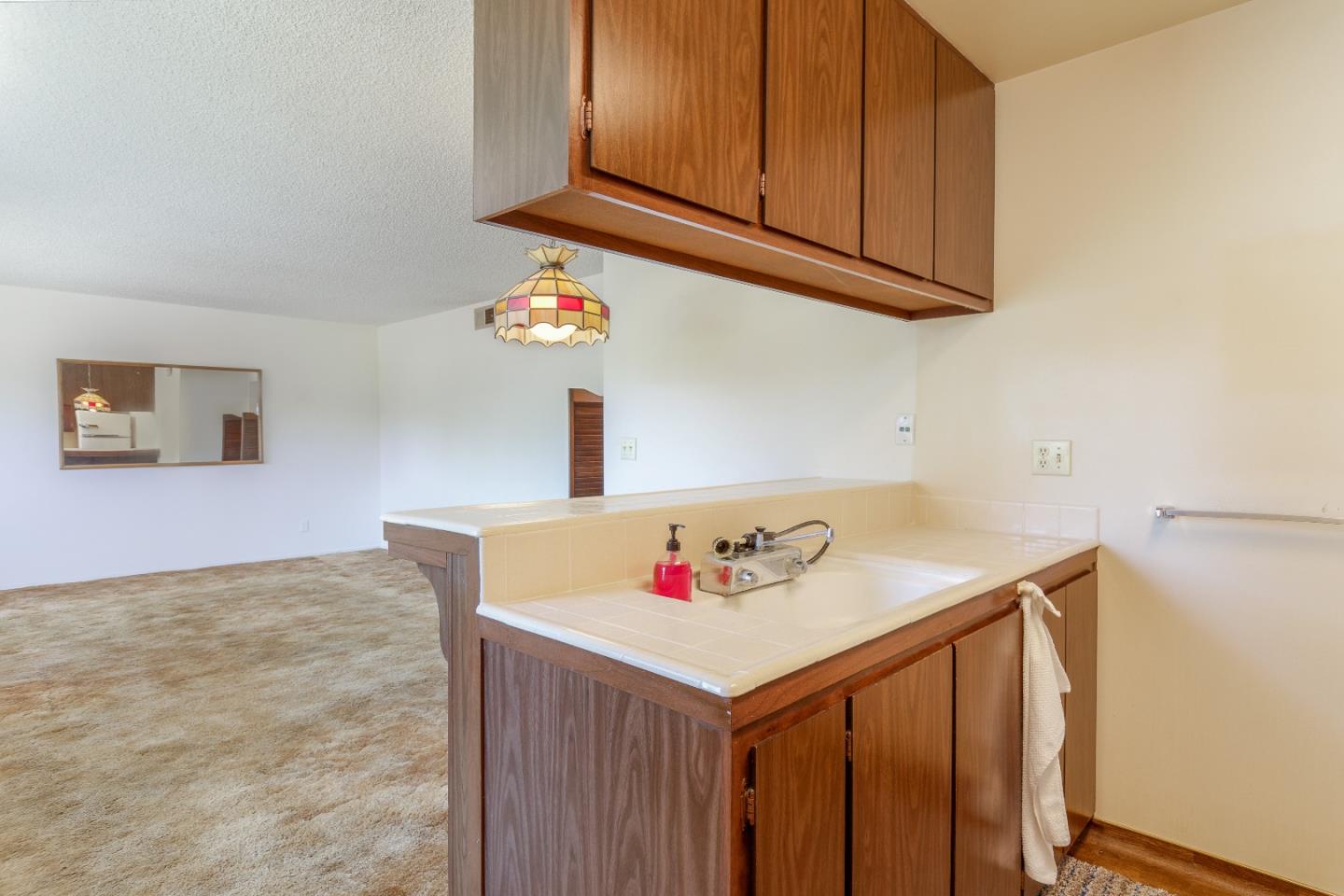 4435 Diamond Street, Unit 1 Capitola, CA 95010 - Photo 6 of 18 a bathroom with a sink and a cabinets
