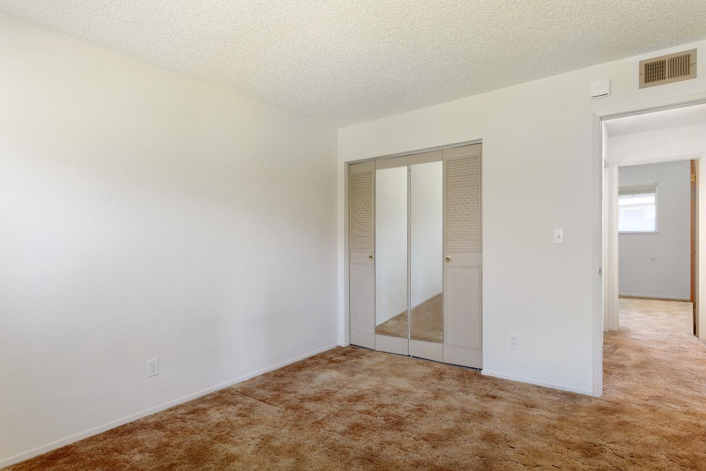 4435 Diamond Street, Unit 1 Capitola, CA 95010 - Photo 7 of 18 an empty room with closet