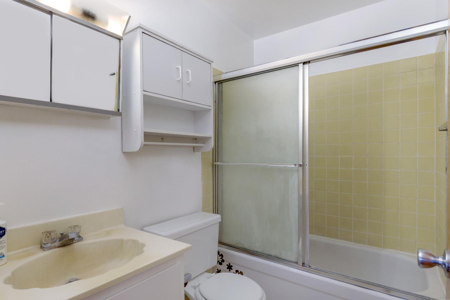4435 Diamond Street, Unit 1 Capitola, CA 95010 - Photo 9 of 18 a bathroom with a shower and a sink