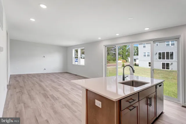 a kitchen with a sink cabinets and window
