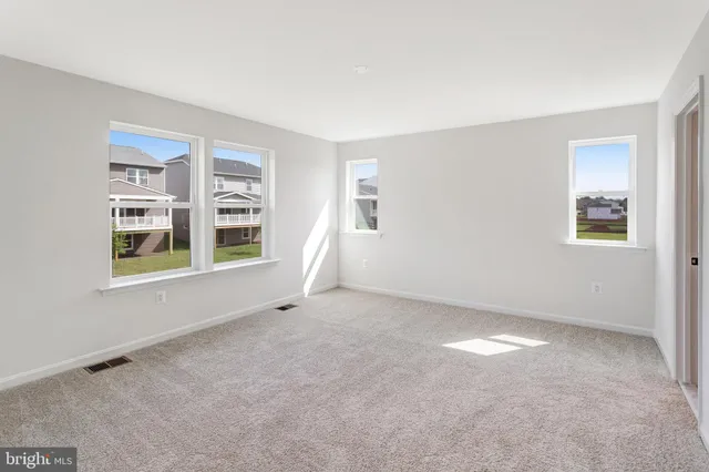 a view of empty room with windows
