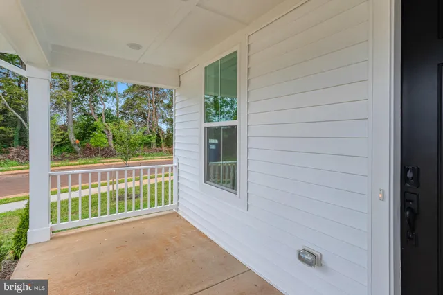 a view of a porch with a bench