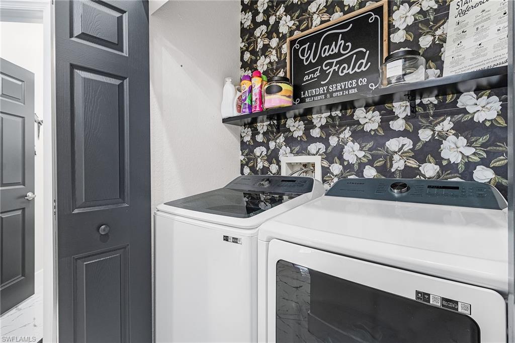 25110 Peacock Lane, Unit 201 Naples, FL 34114 - Photo 17 of 24 a utility room with dryer and washer