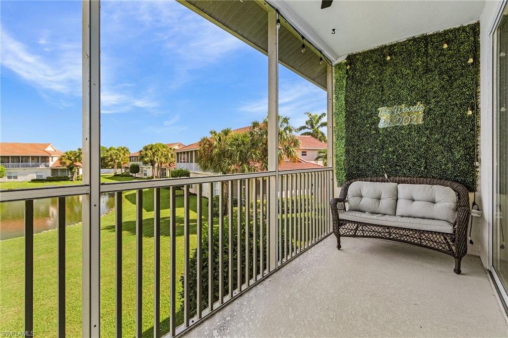 25110 Peacock Lane, Unit 201 Naples, FL 34114 - Photo 18 of 24 a view of a two chairs in the balcony