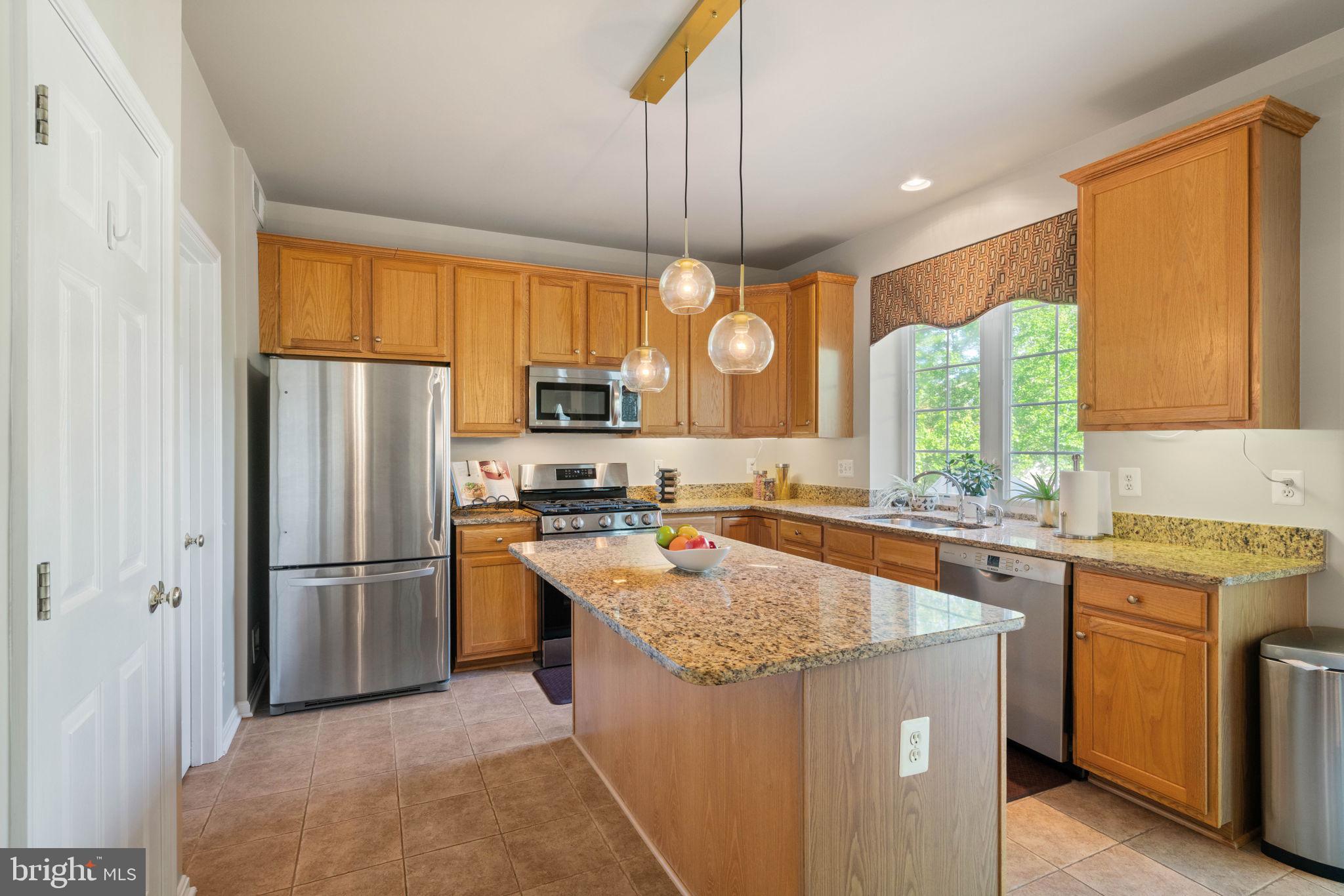 6093 Spindle Tree Court Woodbridge, VA 22193 - Photo 22 of 51 Modern kitchen with warm wood tones.