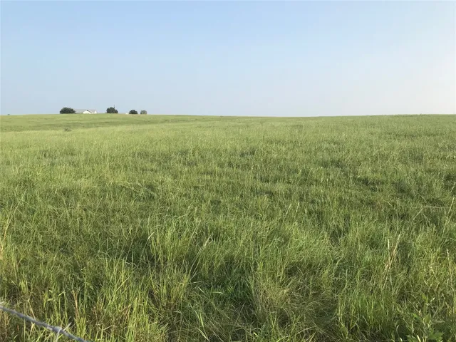a view of a big yard with an outdoor space and seating