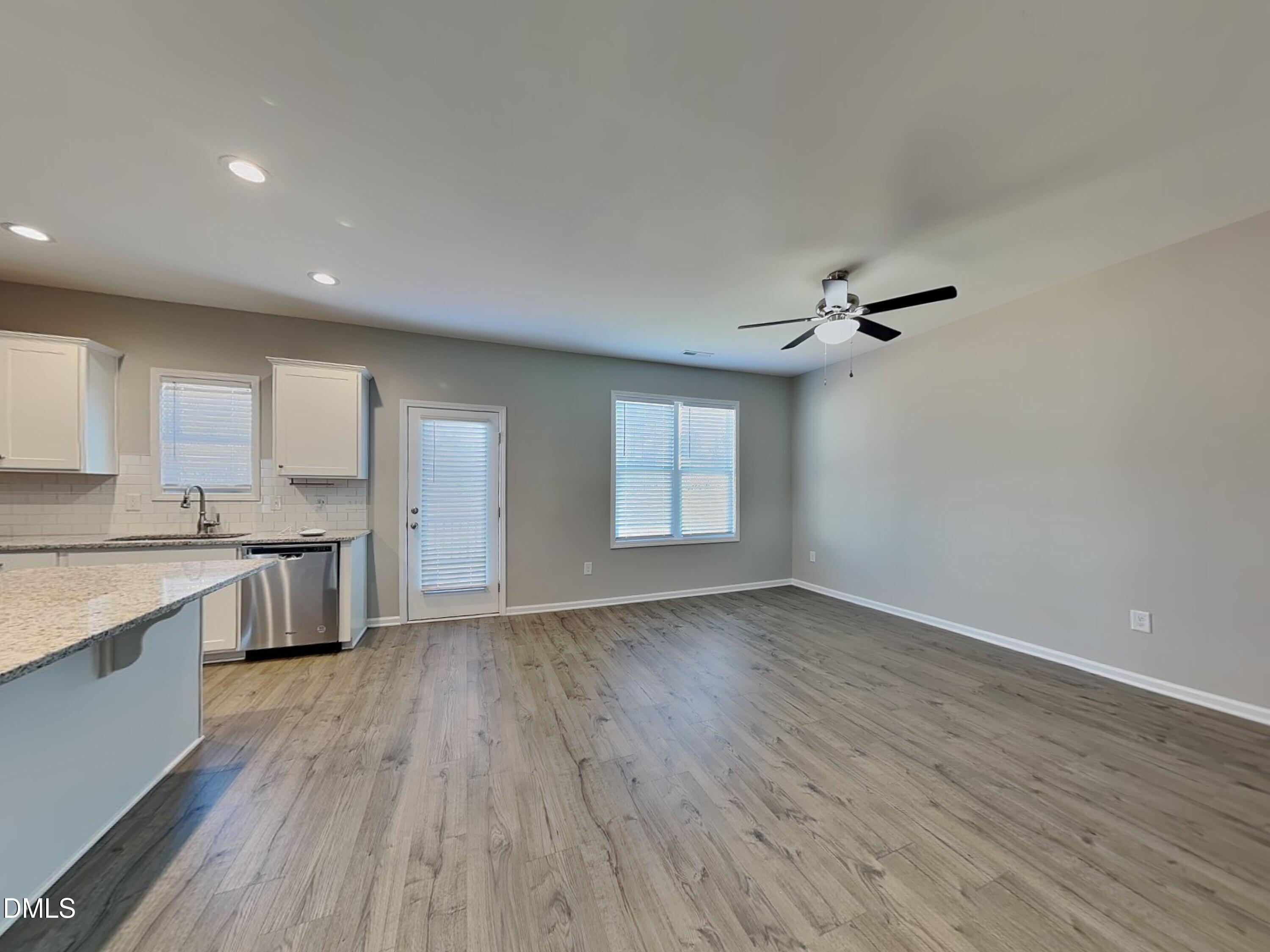 376 Olde Place Zebulon, NC 27597 - Photo 3 of 15 a view of kitchen with a sink wooden floor and a kitchen