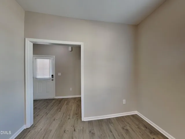 a view of a small space with wooden floor