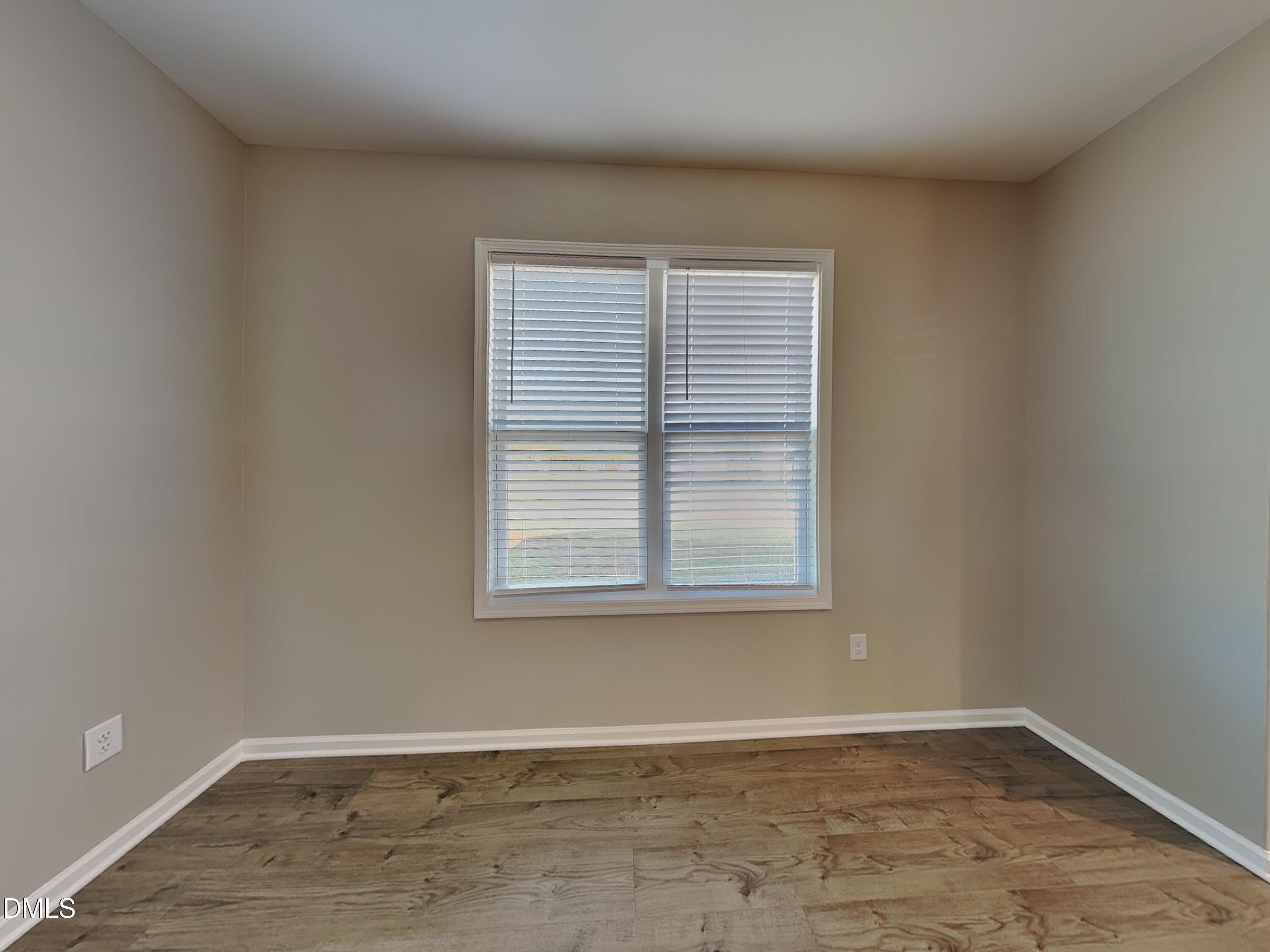 376 Olde Place Zebulon, NC 27597 - Photo 5 of 15 an empty room with a window