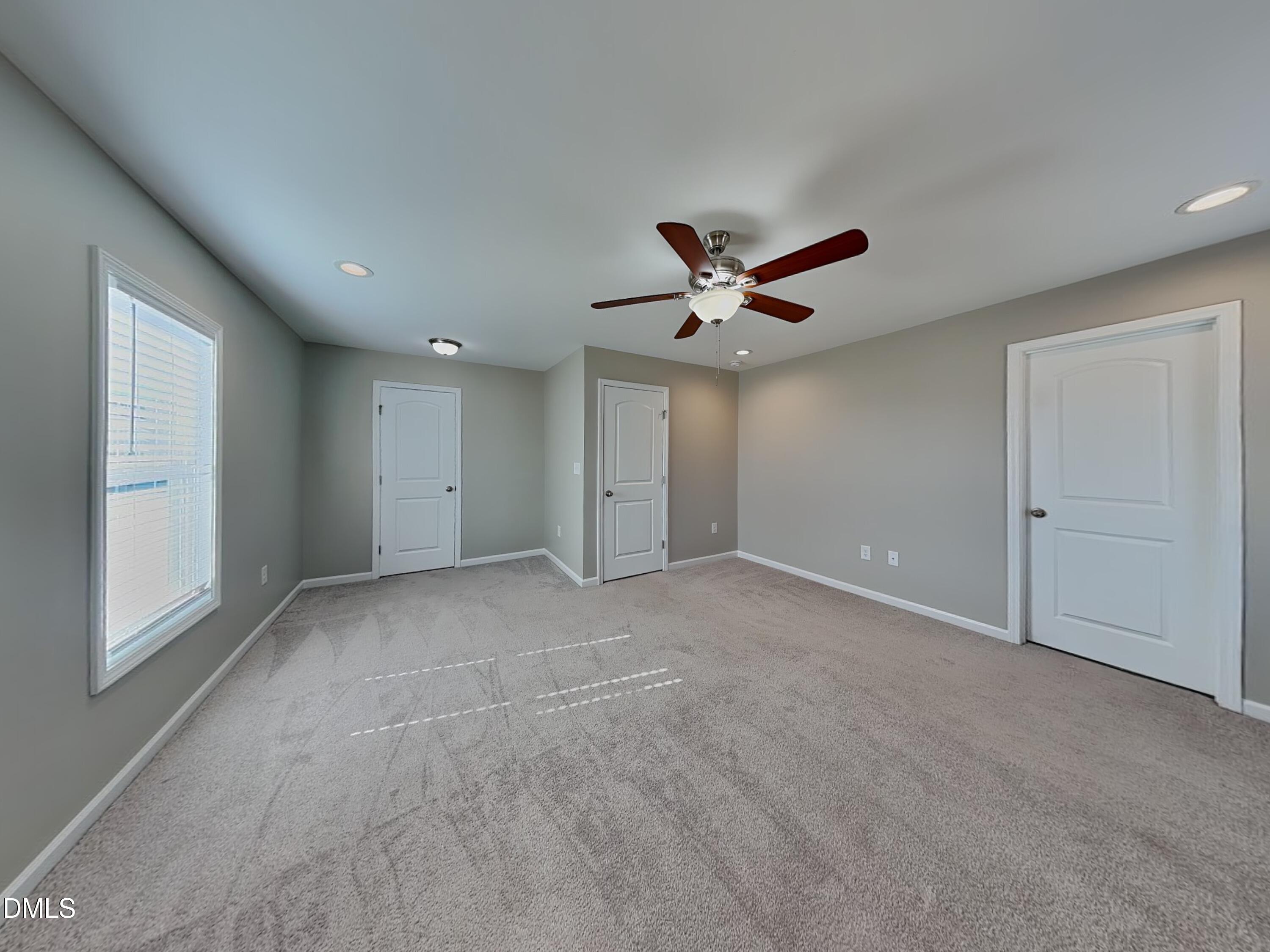 376 Olde Place Zebulon, NC 27597 - Photo 7 of 15 a view of an empty room with a window