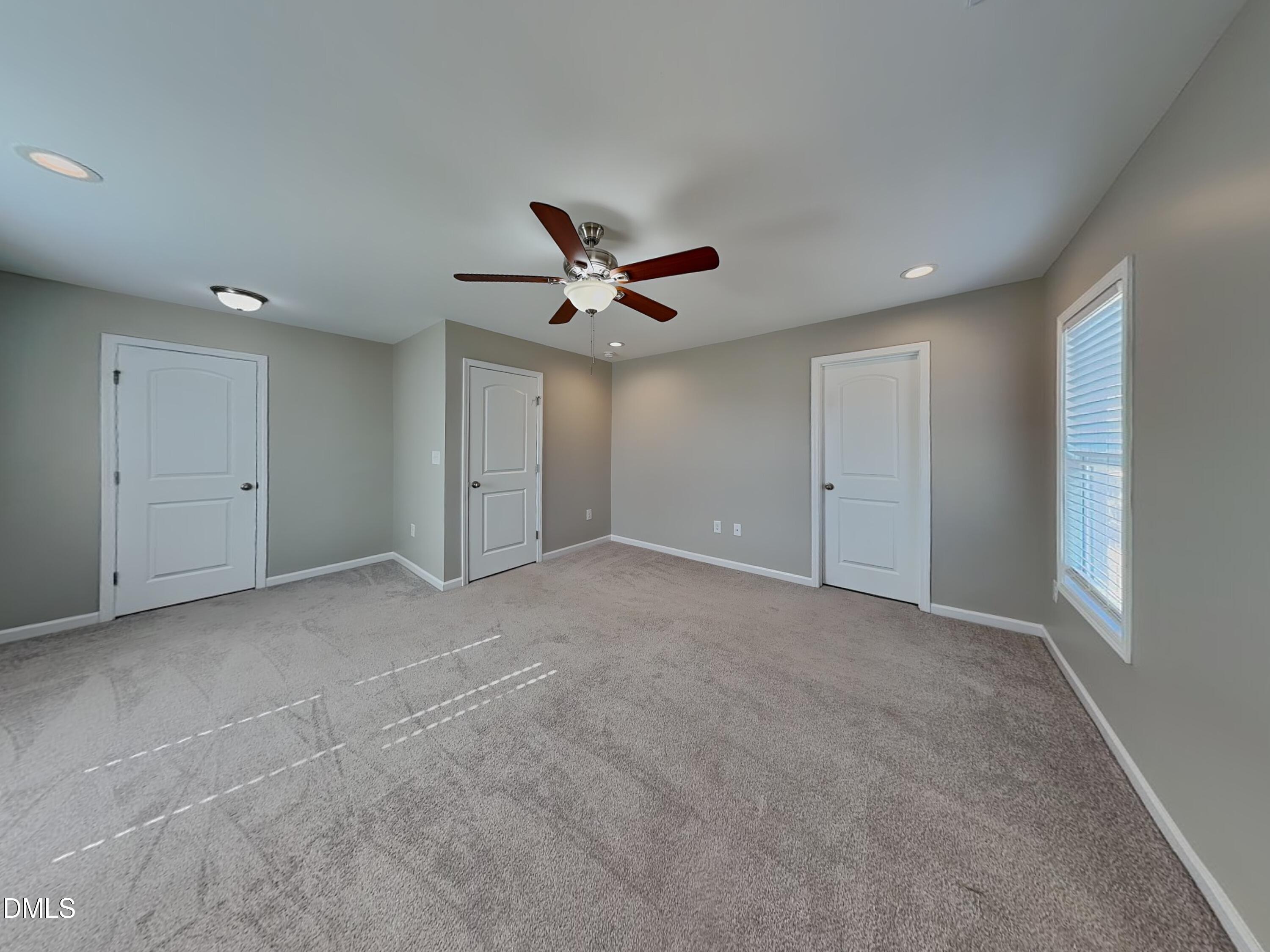 376 Olde Place Zebulon, NC 27597 - Photo 8 of 15 a view of a livingroom with a ceiling fan