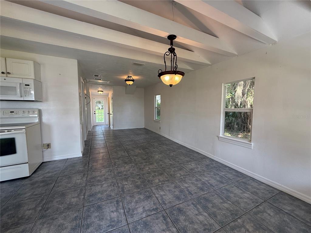 102 Possum Hollow Road Georgetown, FL 32139 - Photo 12 of 24 a view of an empty room with a fireplace and a window