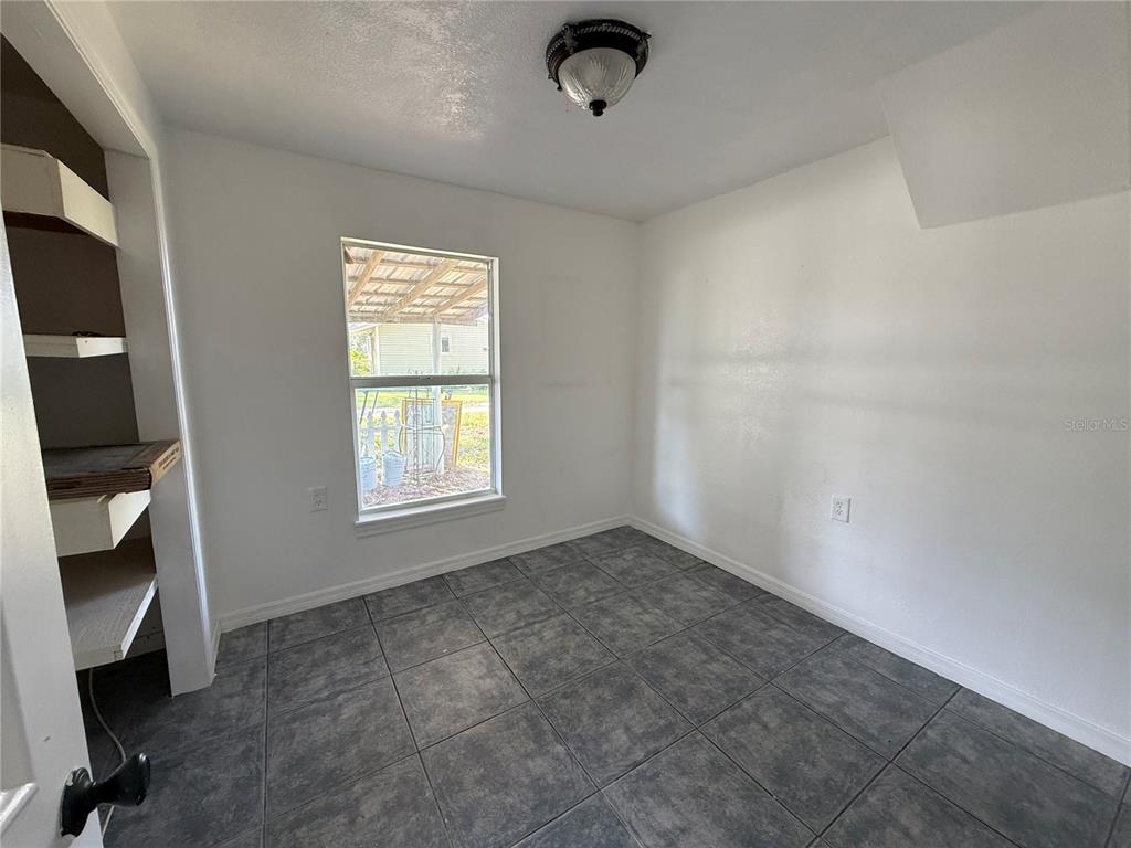 102 Possum Hollow Road Georgetown, FL 32139 - Photo 17 of 24 a view of an empty room with a window and a fireplace