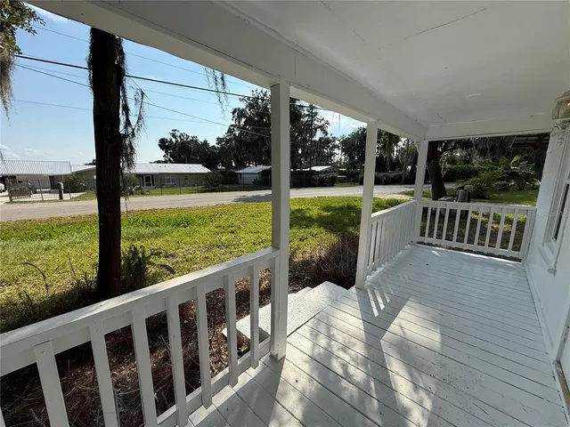 a view of balcony with yard