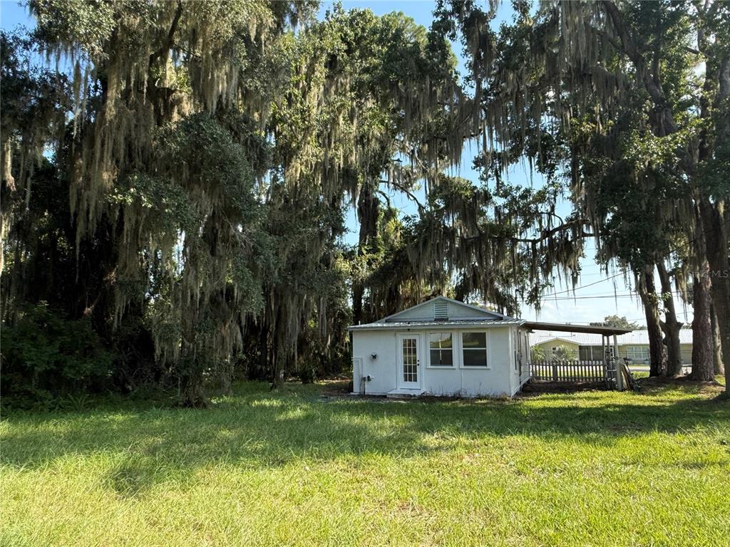 102 Possum Hollow Road Georgetown, FL 32139 - Photo 7 of 24 a front view of a house with a garden