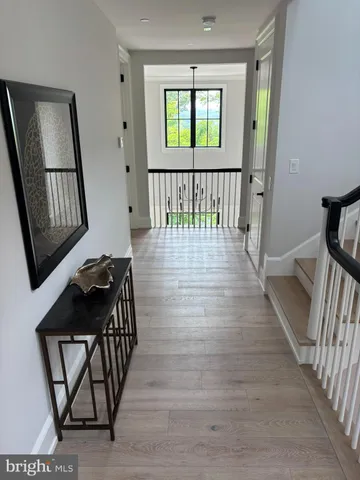 a bed sitting in a bedroom next to a large window