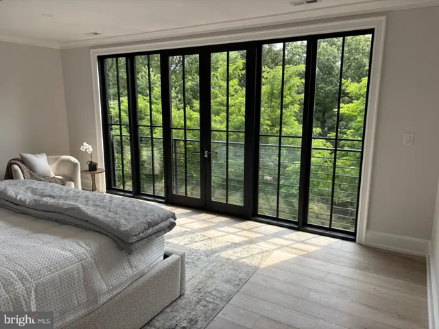 a spacious bedroom with a bed and couch