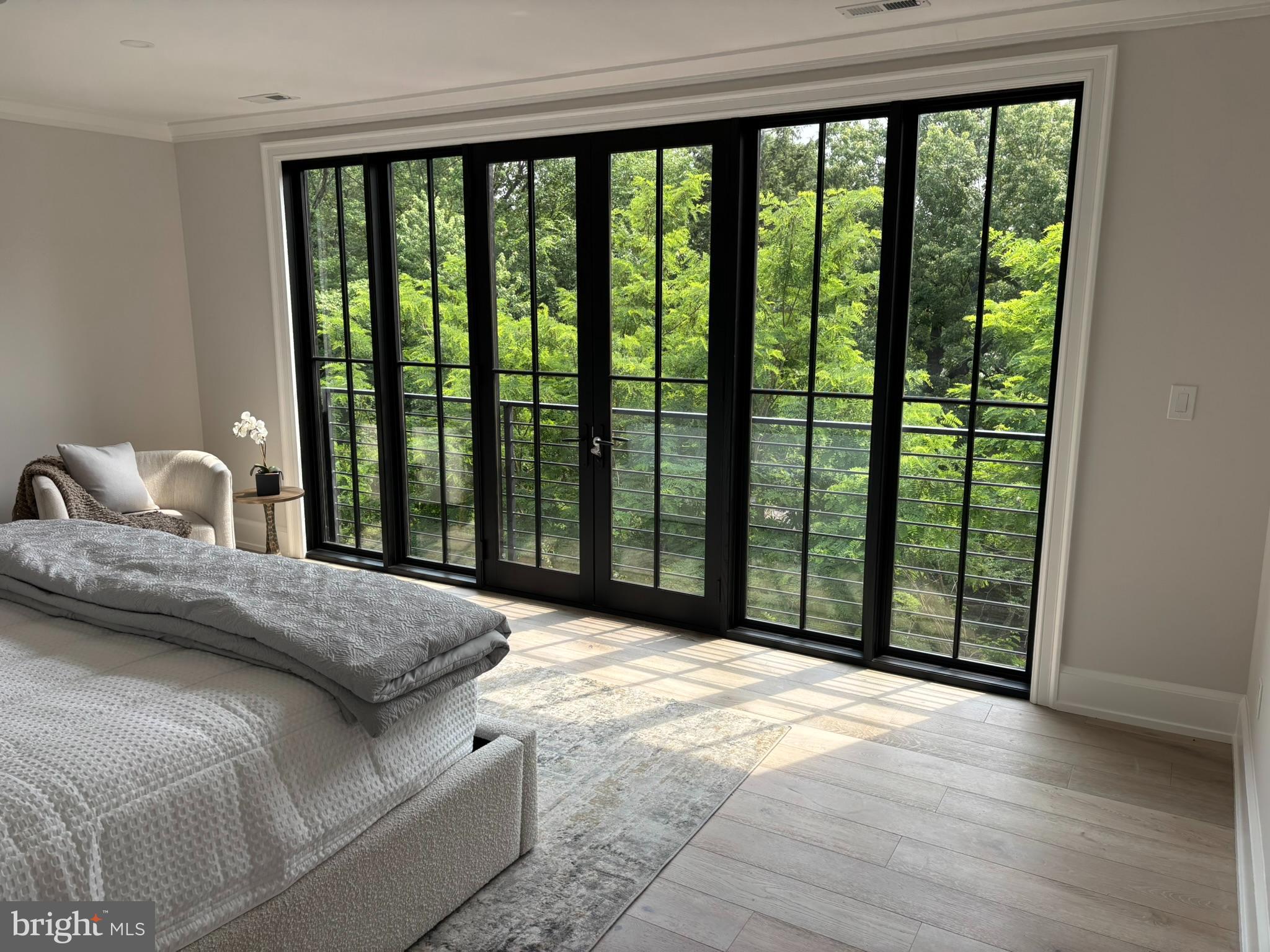 5017 Eskridge Terrace Northwest Washington, DC 20016 - Photo 16 of 45 a bed sitting in a bedroom next to a large window
