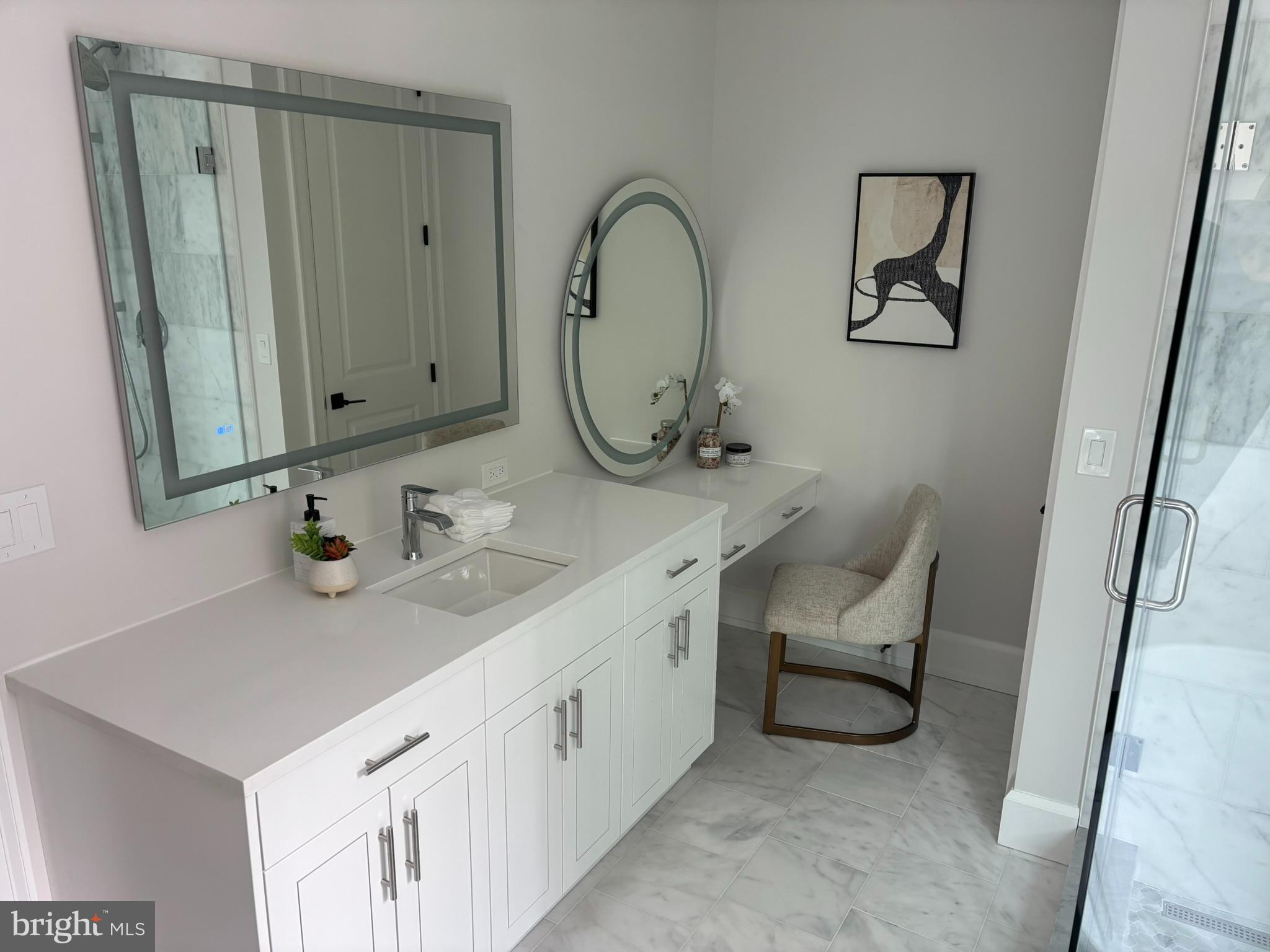 5017 Eskridge Terrace Northwest Washington, DC 20016 - Photo 18 of 45 a bathroom with 2 sink and a mirror