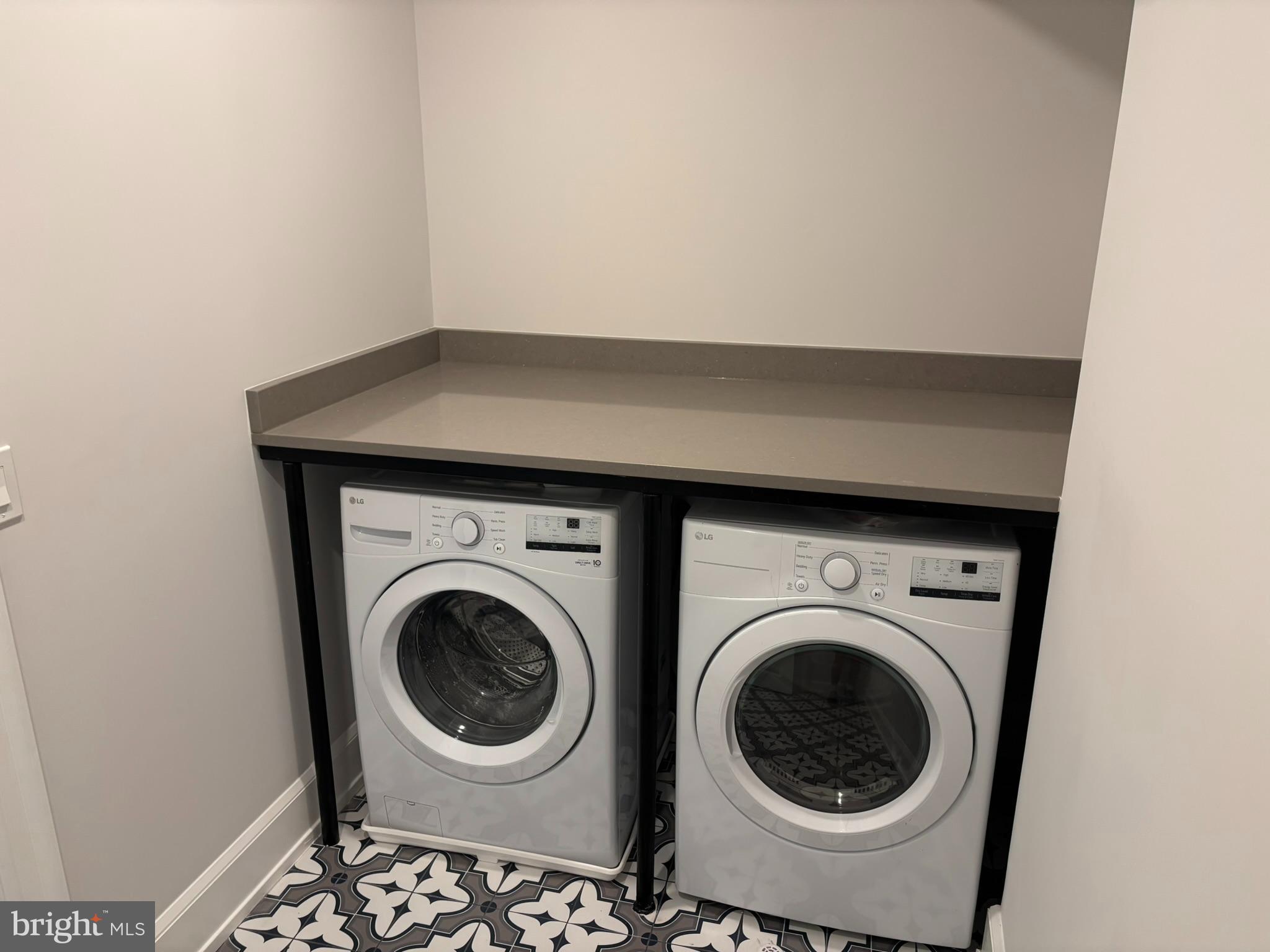 5017 Eskridge Terrace Northwest Washington, DC 20016 - Photo 20 of 45 a utility room with dryer and washer