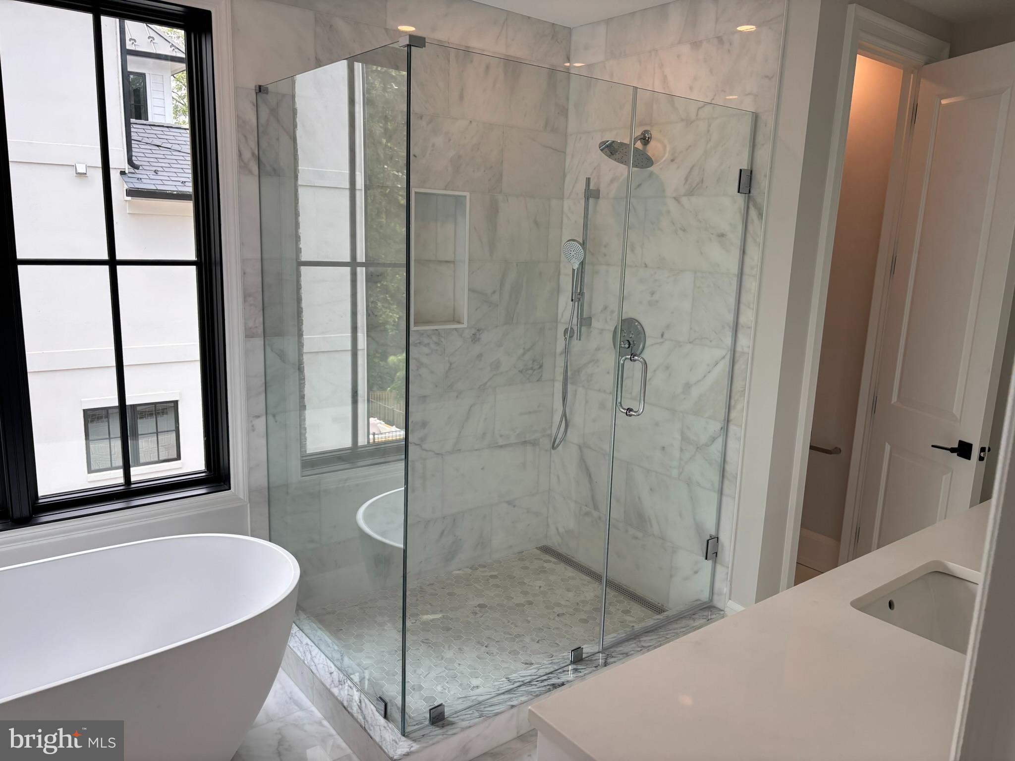 5017 Eskridge Terrace Northwest Washington, DC 20016 - Photo 26 of 45 a bathroom with a bathtub and a shower