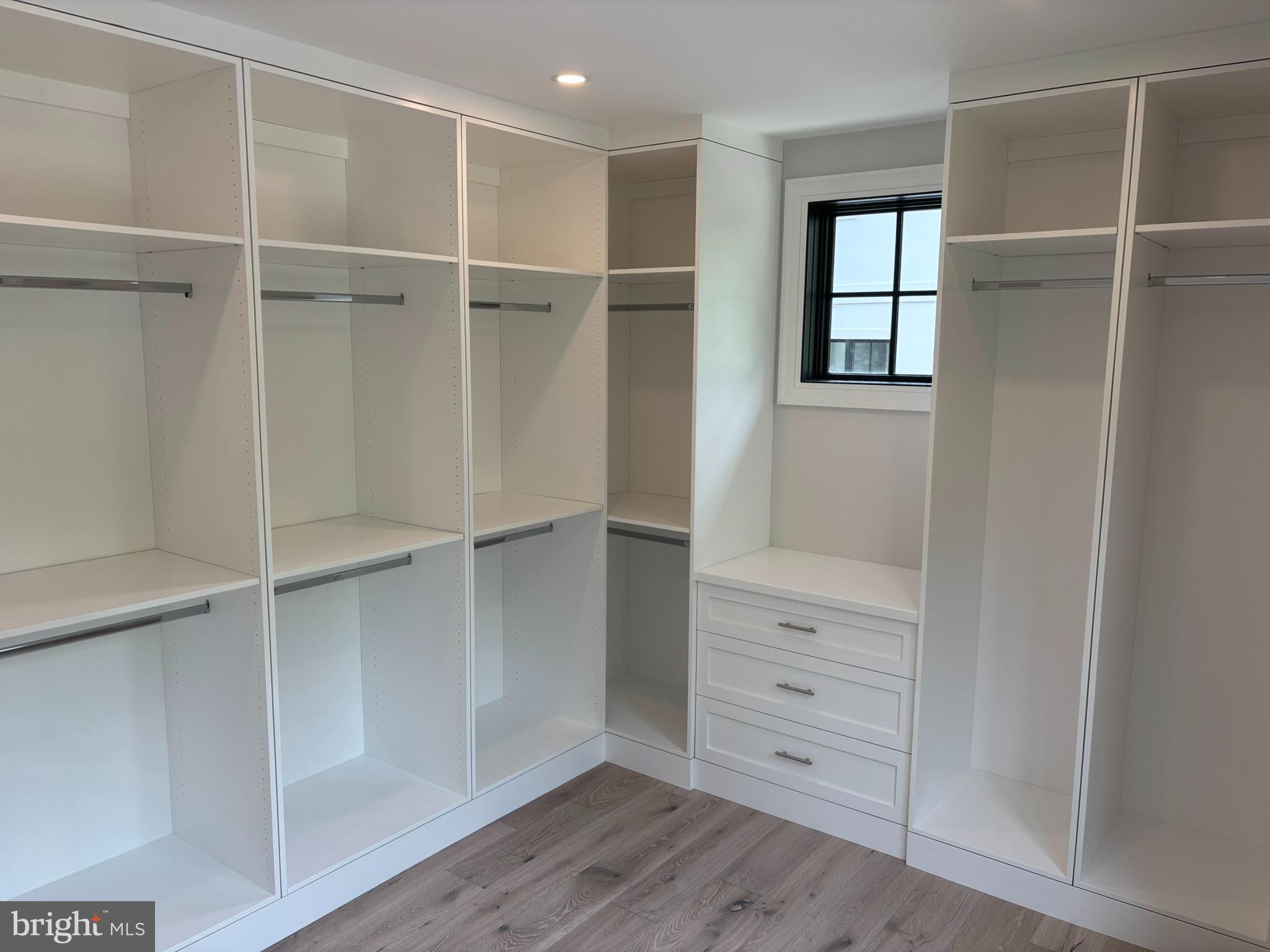 5017 Eskridge Terrace Northwest Washington, DC 20016 - Photo 29 of 45 a view of walk in closet with empty racks