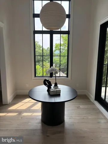 a living room with furniture rug and a fireplace