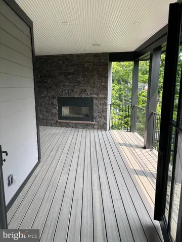 a view of backyard with a deck