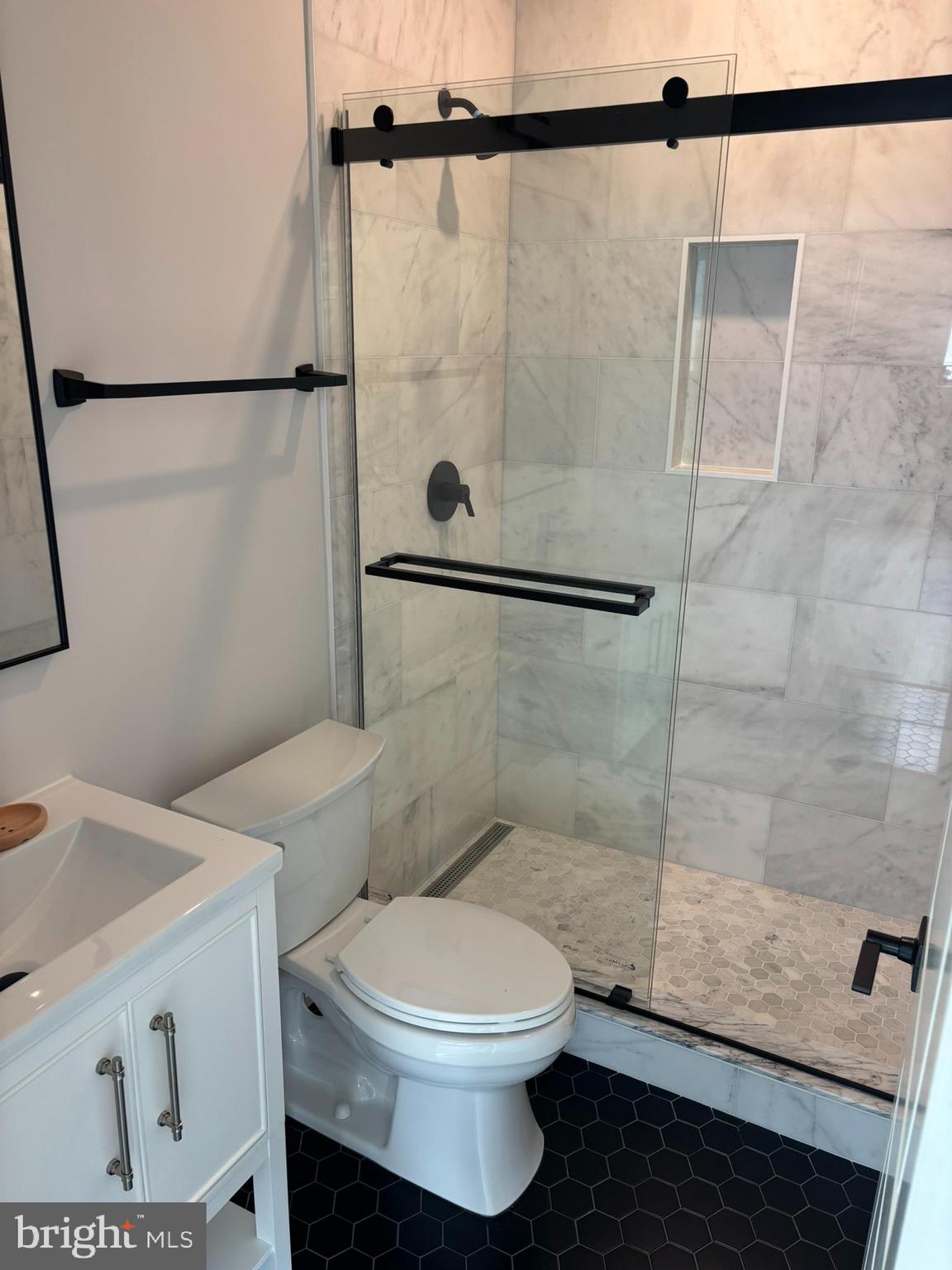 5017 Eskridge Terrace Northwest Washington, DC 20016 - Photo 10 of 45 a bathroom with a toilet and a shower
