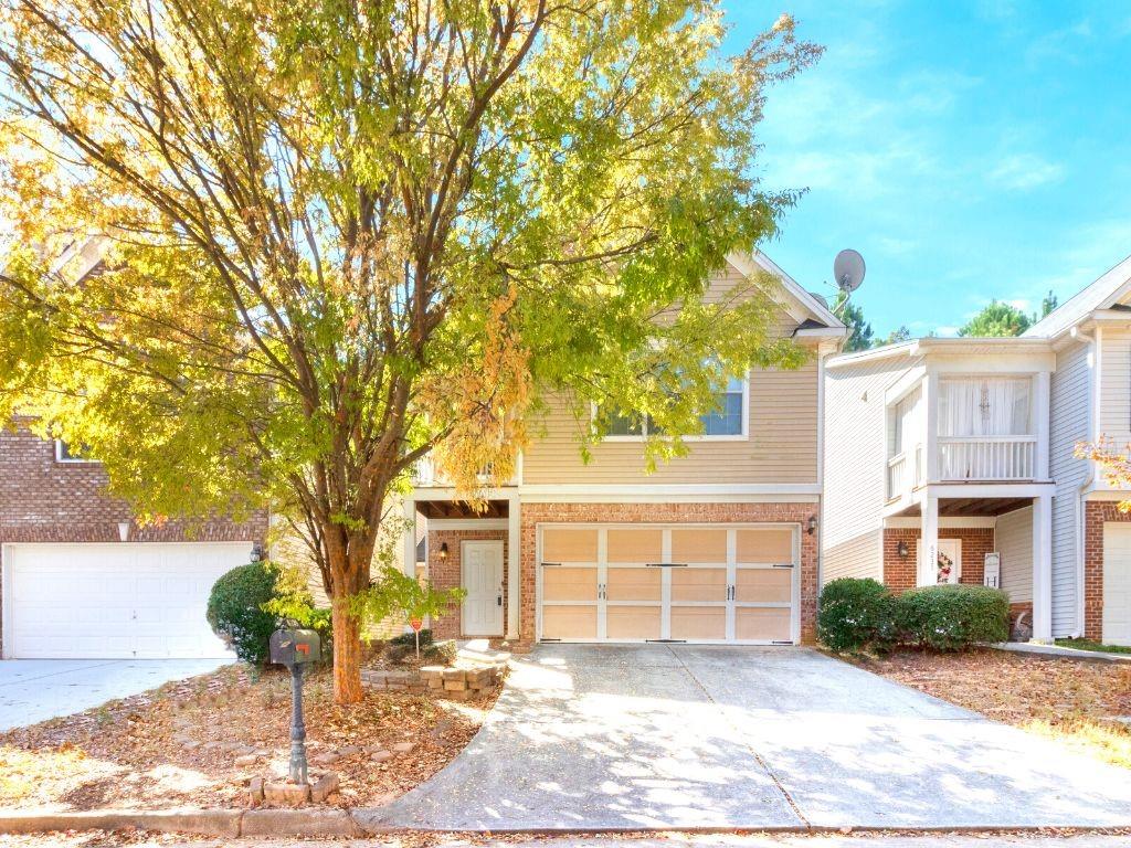 6239 Lake Valley Point Lithonia, GA 30058 - Photo 1 of 1 a front view of a house with garden
