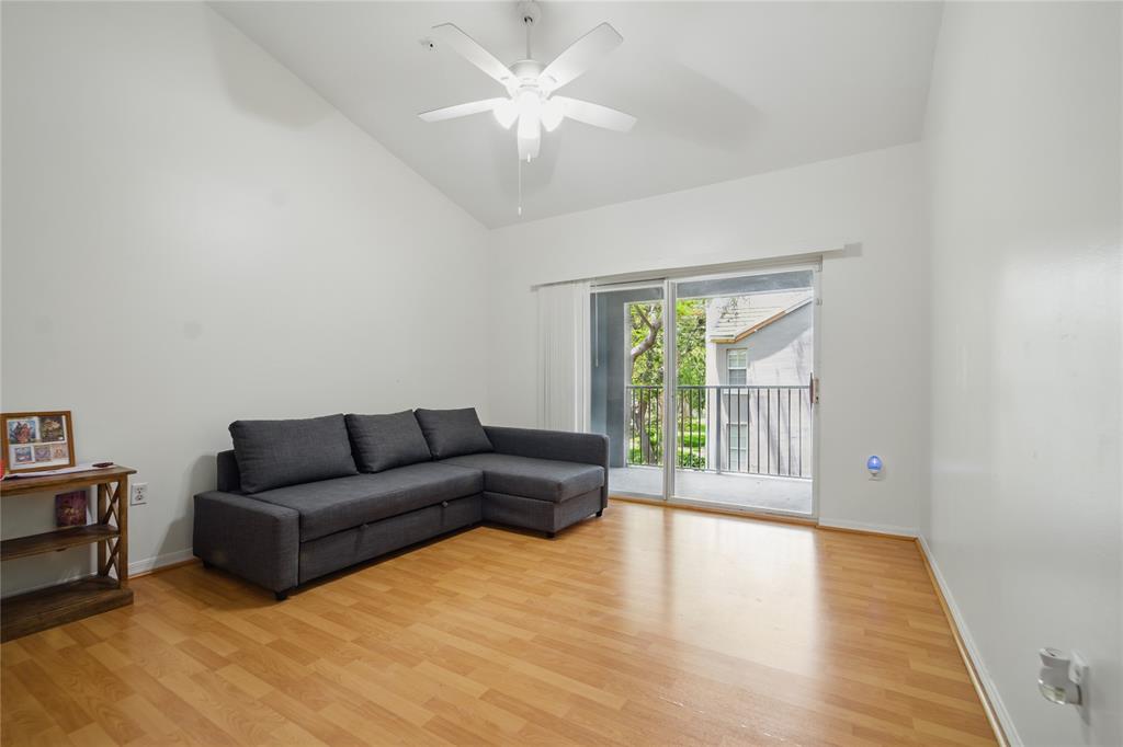 11133 Southwest 8th Street, Unit 306 Pembroke Pines, FL 33025 - Photo 3 of 14 a living room with furniture and a large window